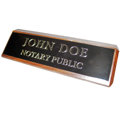 This elegant, genuine Arizona notary walnut desk, sign is made of solid wood and engraved on a metal plate with gold lettering with your notary name and the wording 'Notary Public'. It makes a fine addition to any desk or office. This sign can be customized with up to two lines.